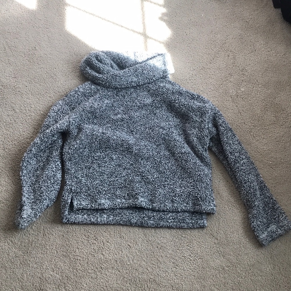 A fluffy turtle neck sweater